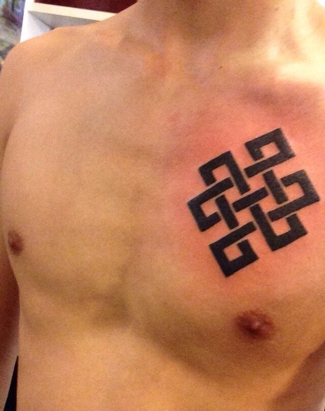 Black Color Endless Knot Chest Tattoo