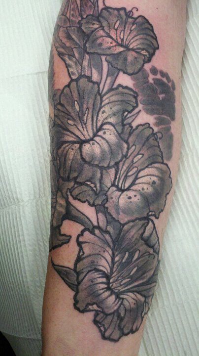 Black Gladiolus Flowers Tattoo On Arm