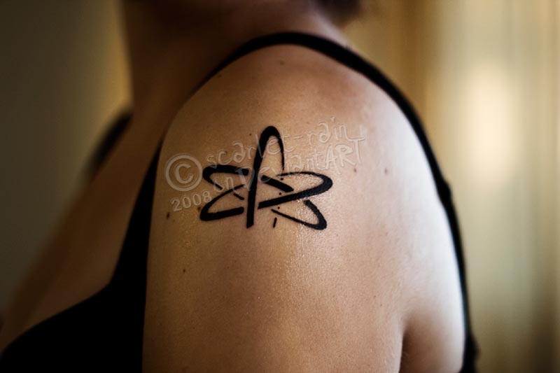 Black Science Tattoo On Left Shoulder For Girls
