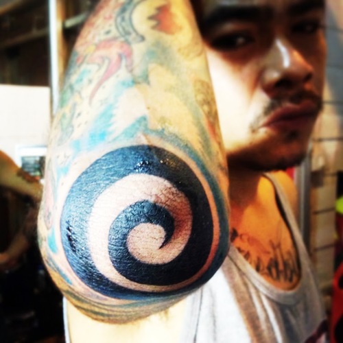 Black Spiral Tattoo On Elbow For Men