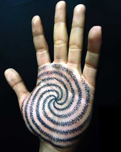 Black Spiral Tattoo On Hand Palm