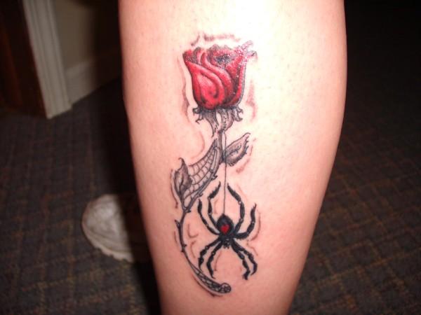 Black Widow With Rose Tattoo On Leg
