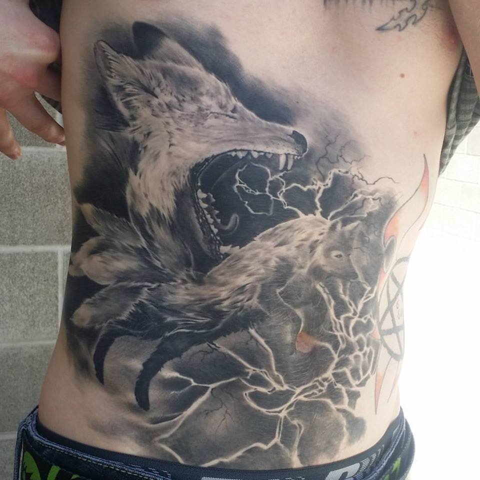 Black and grey foxy tattoo on belly