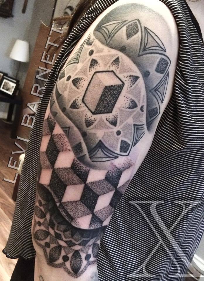 Black and white geometrical design tattoo on half sleeve by Levi Barnett