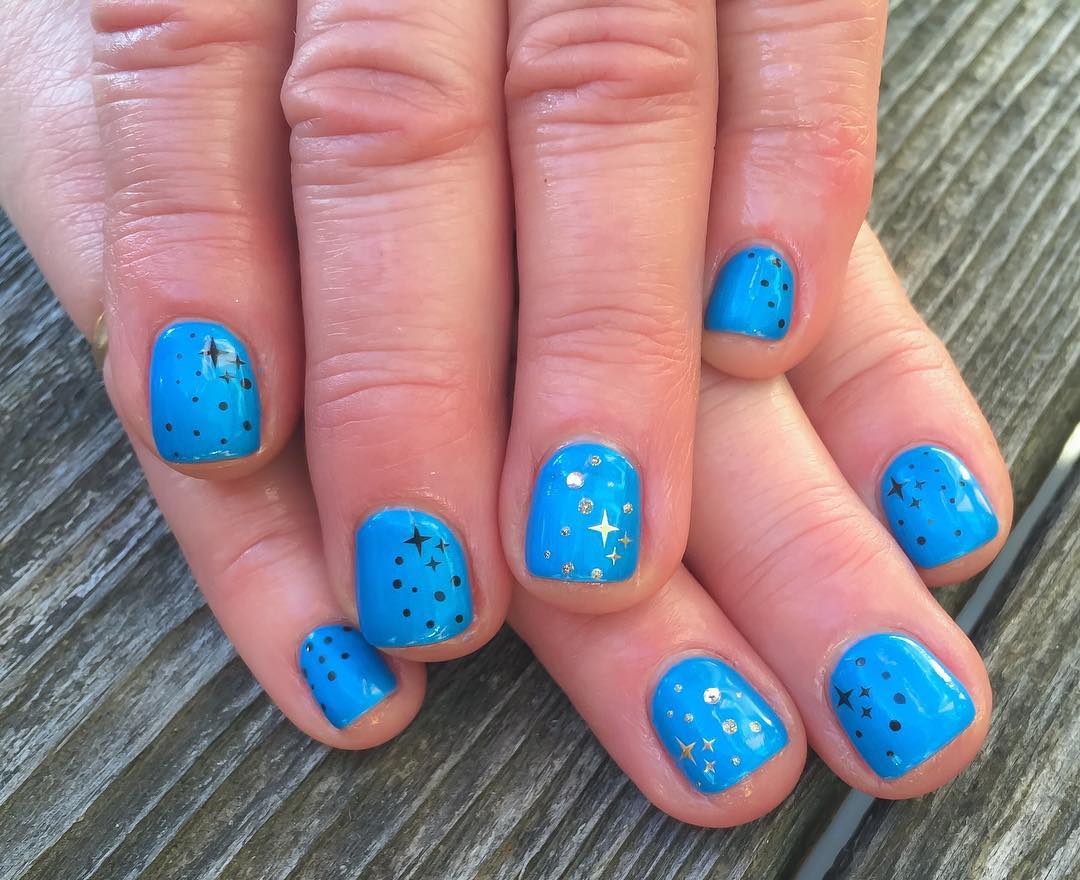 Blue Acrylic Short Nails With Black And Gold Stars Design Idea