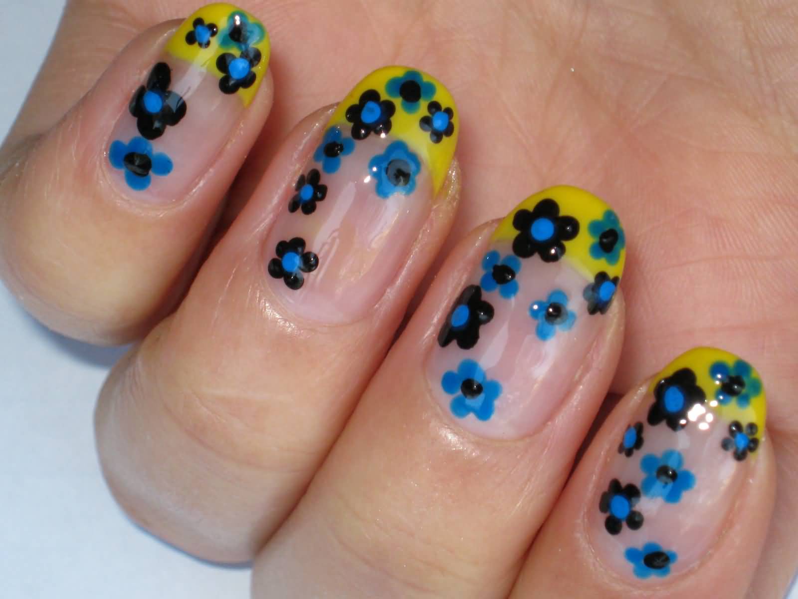 Blue Flowers And Yellow French Tip Nail Art