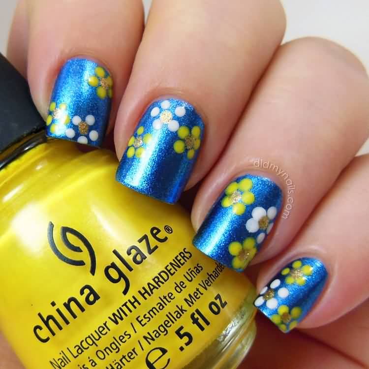 Blue Nails With Yellow And White Flowers Nail Art.