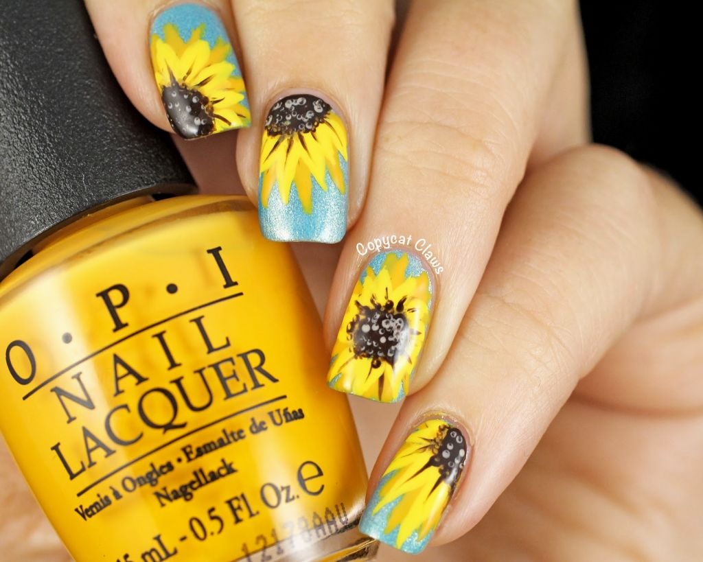 Blue Nails With Yellow Sunflower Nail Art