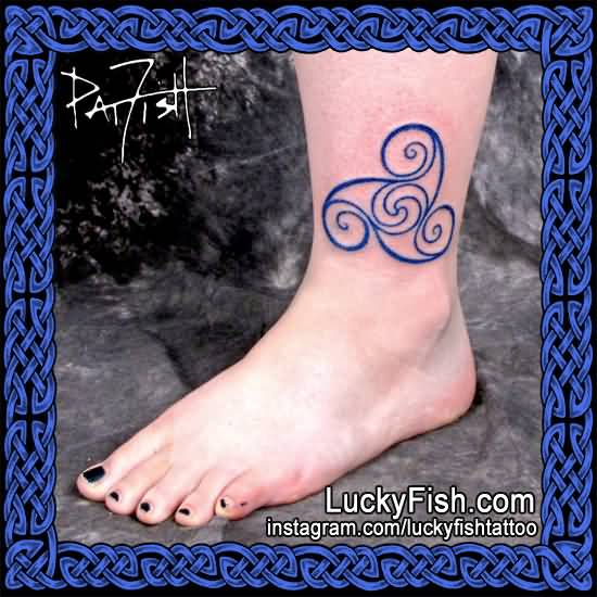 Blue Spiral Tattoo On Left Ankle