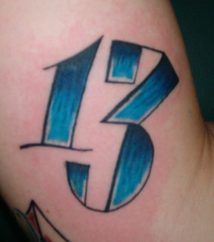 Blue Unlucky Number Tattoo On Arm
