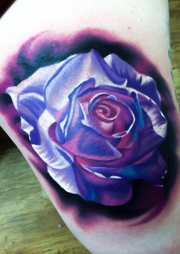 Blue rose tattoo on arm by Levi Barnett