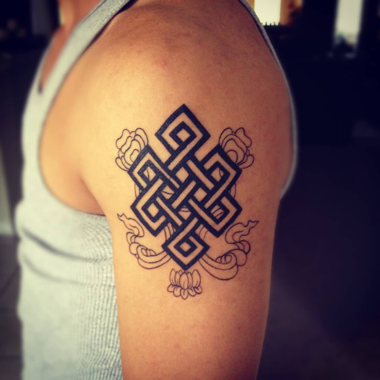 Buddhist Endless Knot With Lotus Flower Tattoo On Left Shoulder