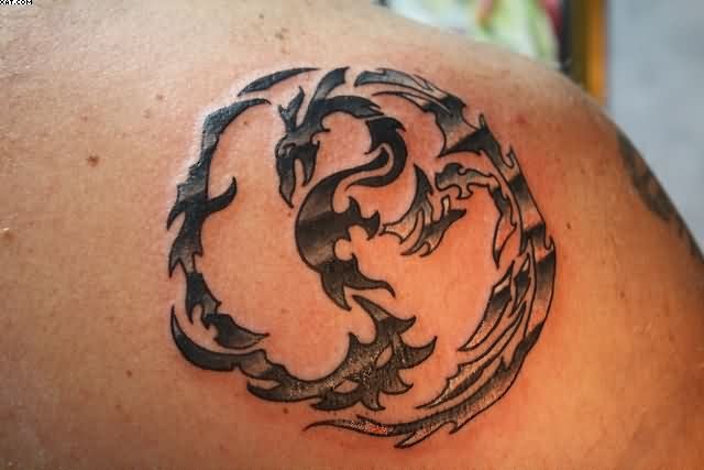 Circle Tribal Western Dragon Symbol Tattoo On Back Shoulder