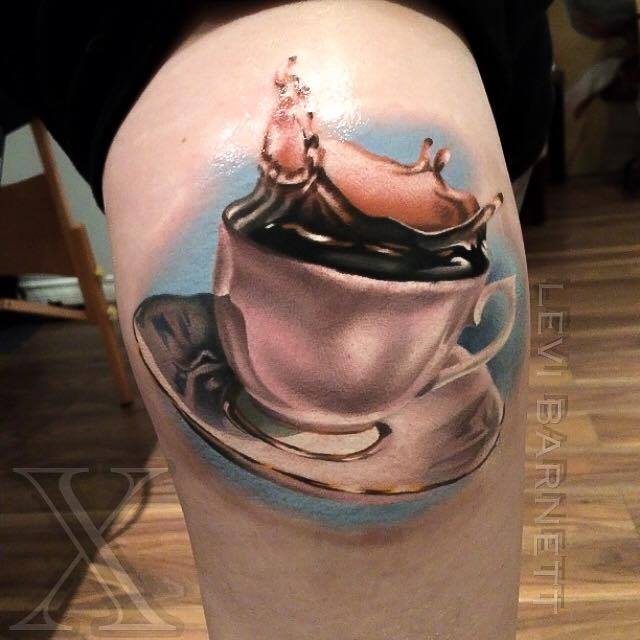 Coffee cup tattoo on arm by Levi Barnett