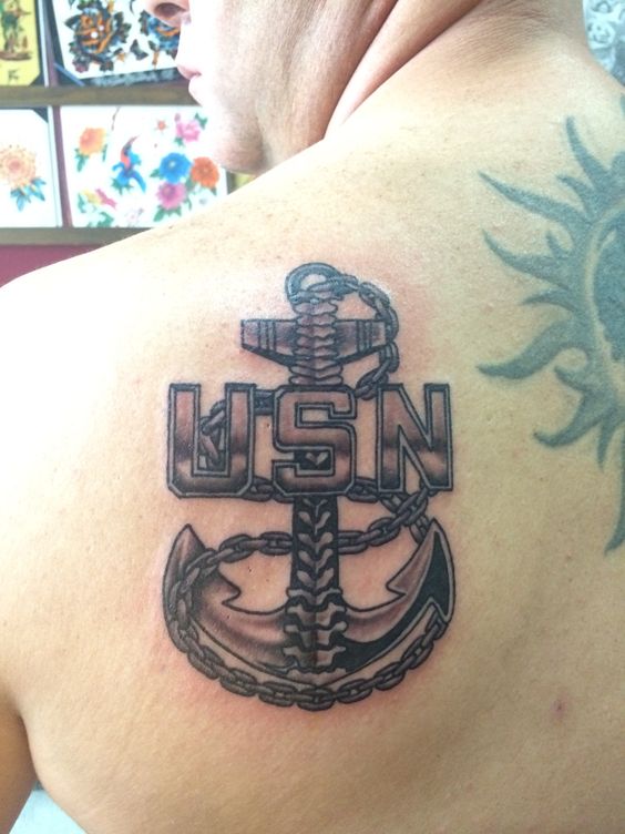 Cool Grey US Navy Symbol Tattoo On Back Shoulder