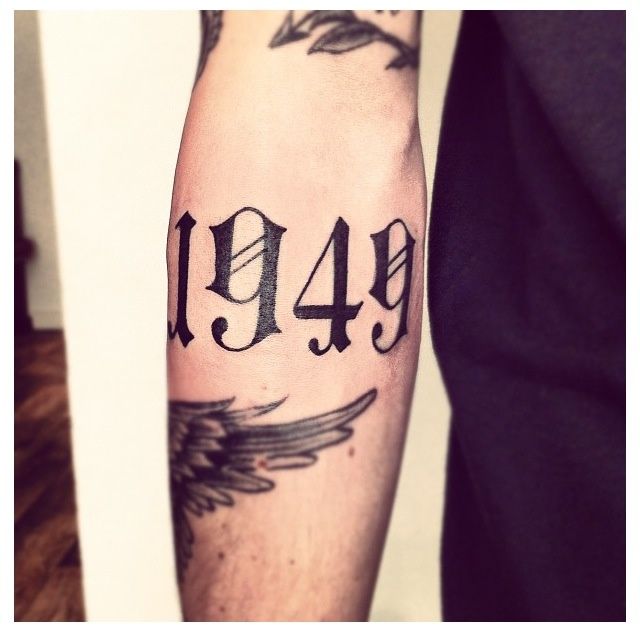 Cool Number Font Tattoo On Forearm