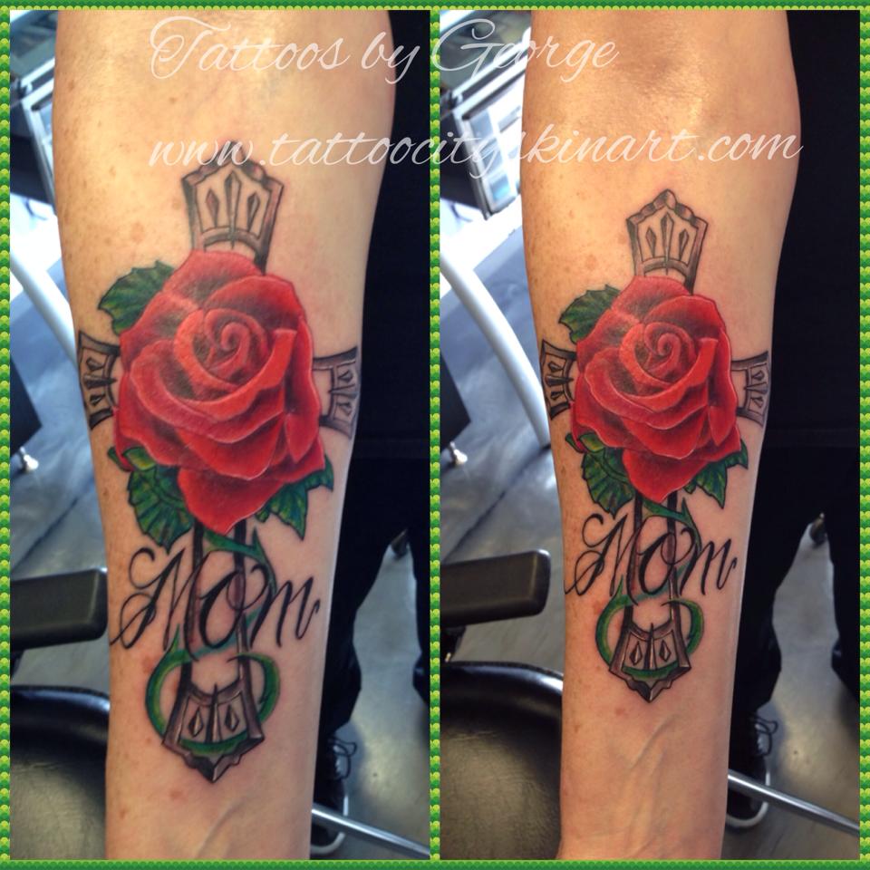 Cross With Rose Remembrance Tattoo For Mom On Forearm
