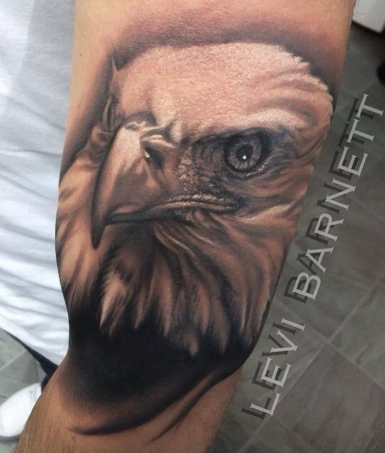 Eagle tattoo on bicep by Levi Barnett