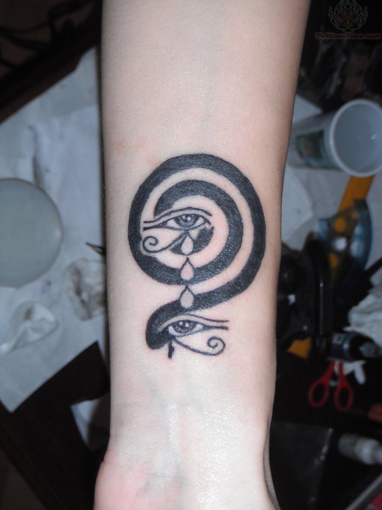 Eyes Of Horus With Spiral Tattoo On Wrist