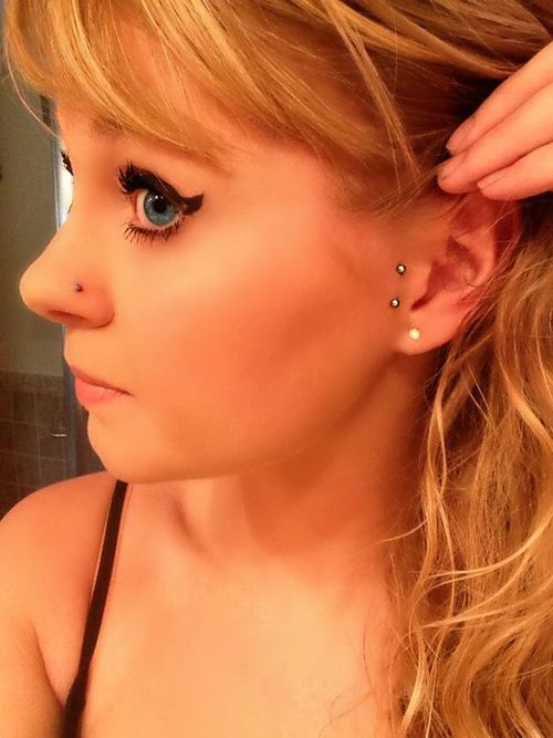 Girl Showing Her Surface Ear Piercing