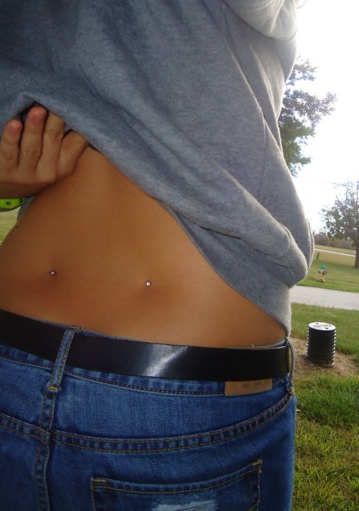 Girl Showing Lower Back Dimple Piercing Picture