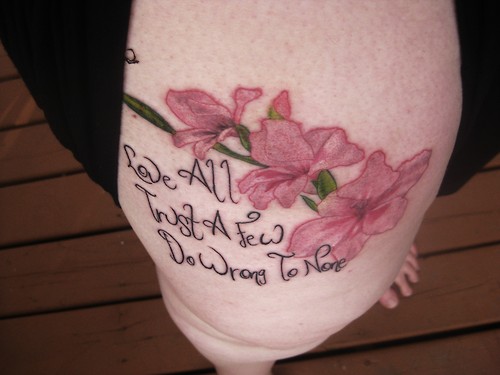 Gladiolus With Wording Tattoo On Thigh