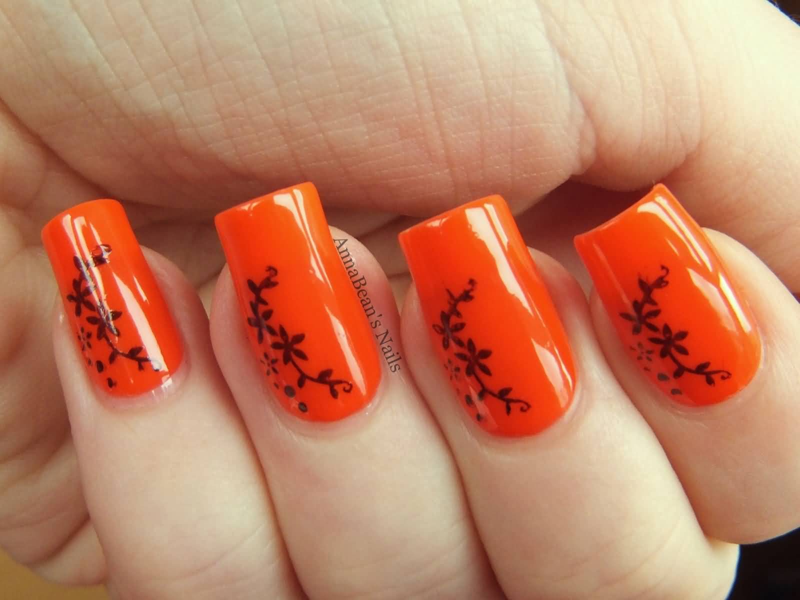 Glossy Orange And Floral Design Nail Art