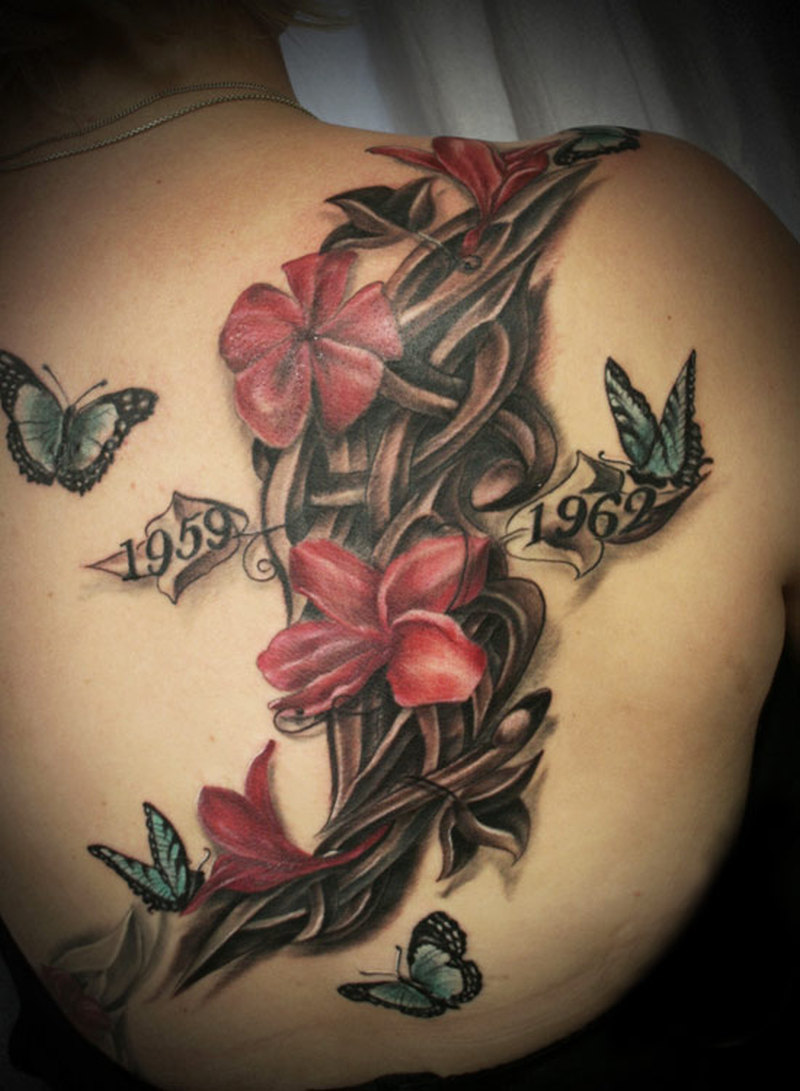 Great Flower Remembrance Tattoo On Upper Back