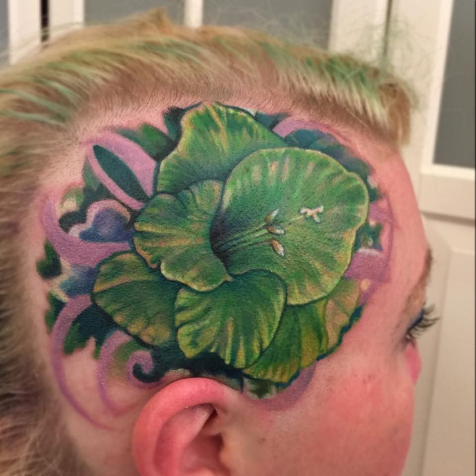 Green Gladiolus Flower tattoo on head by Liz Cook