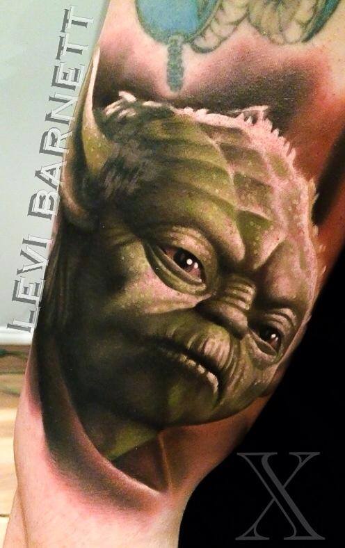 Green dragon tattoo on arm by Levi Barnett