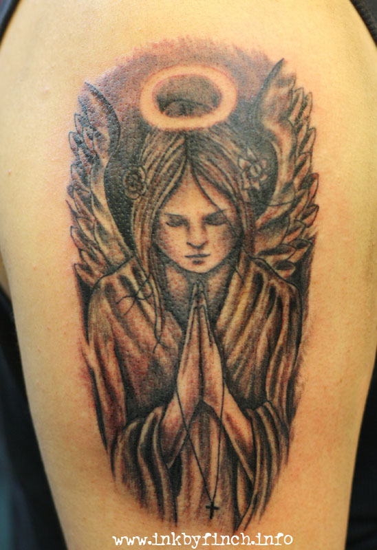 Grey And Black Praying Angel Tattoo On Left Half Sleeve.
