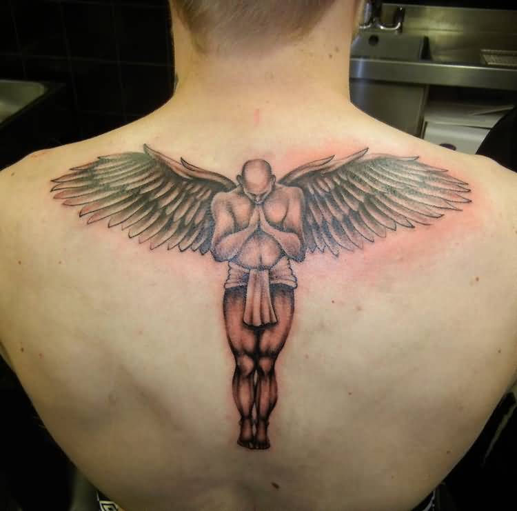 Grey And Black Praying Angel Tattoo On Upper Back
