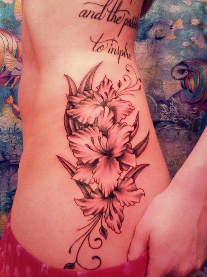 Grey Gladiolus Flower Tattoo On Side Rib For Girls