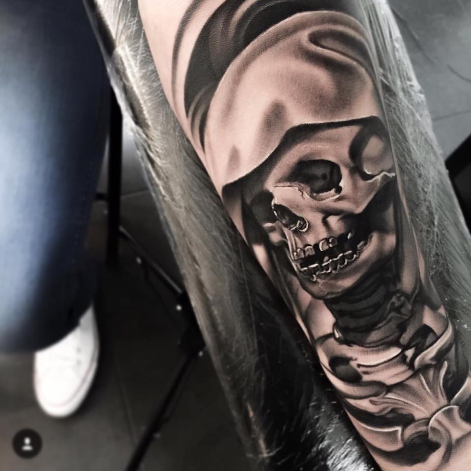 Grey ink skeleton tattoo by Levi Barnett