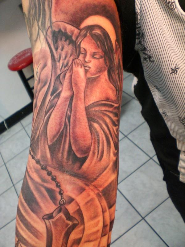Impressive Praying Angel With Cross Tattoo On Sleeve