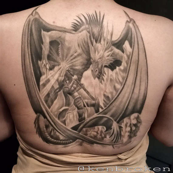 Incredible Western Dragon And Warrior Tattoo On Back For Girls