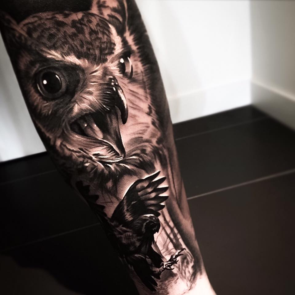 Incredible black and grey eagle tattoo on arm by Levi Barnett