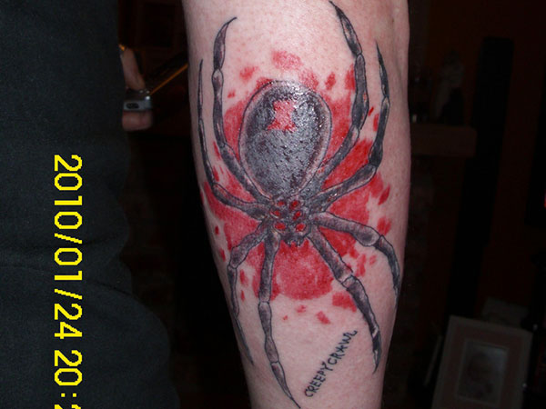 Injured Black Widow Tattoo On Arm