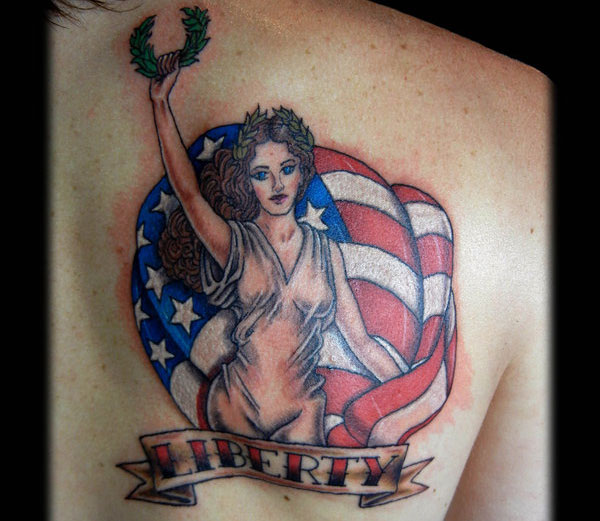 Liberty Classic Pin Up Tattoo On Upper Back