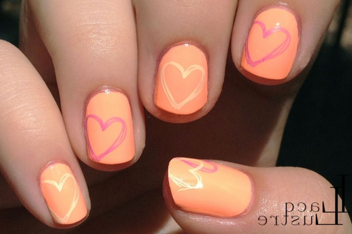 Light Orange Nails With Hearts Design Nail Art