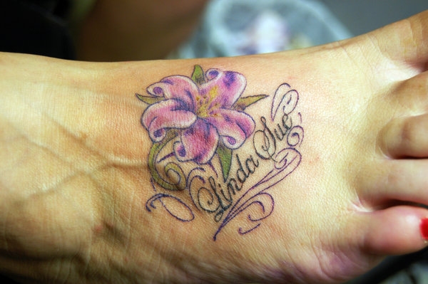Lilly Memorial Tattoo On Foot For Girls