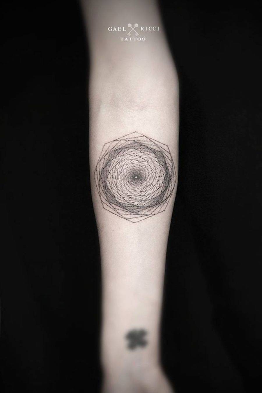 Linework Spiral Tattoo On Forearm