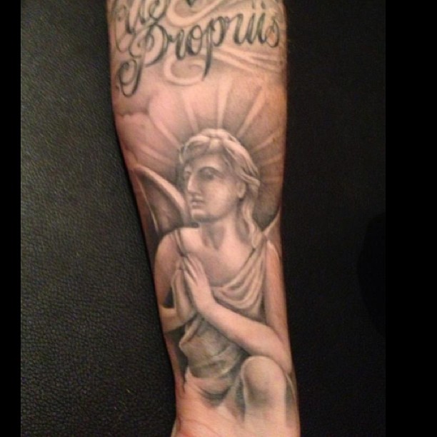 Lovely Praying Angel With Rays Tattoo On Arm Sleeve