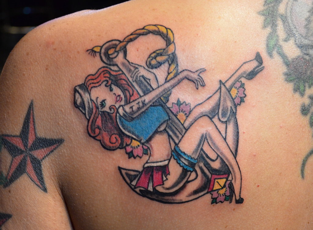 Lovely Sailor Pin Up Girl Tattoo On Left Back Shoulder