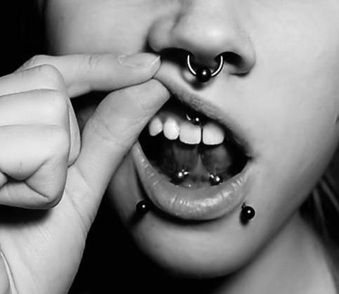 Lower Lip Piercing With Studs And Tongue Frenulum Piercing