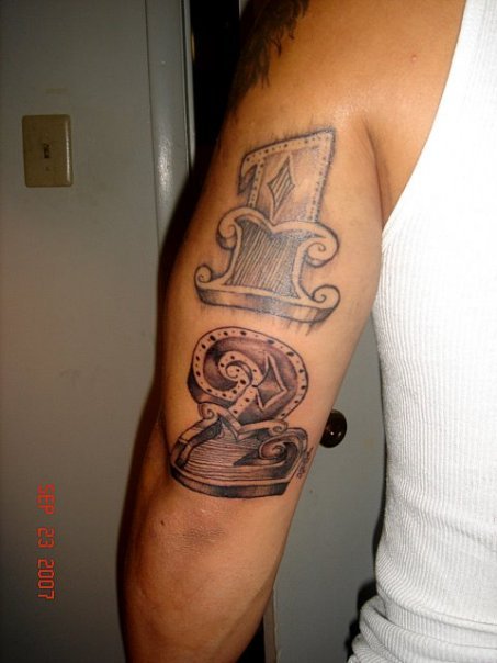 Music Numbers Tattoo On Triceps