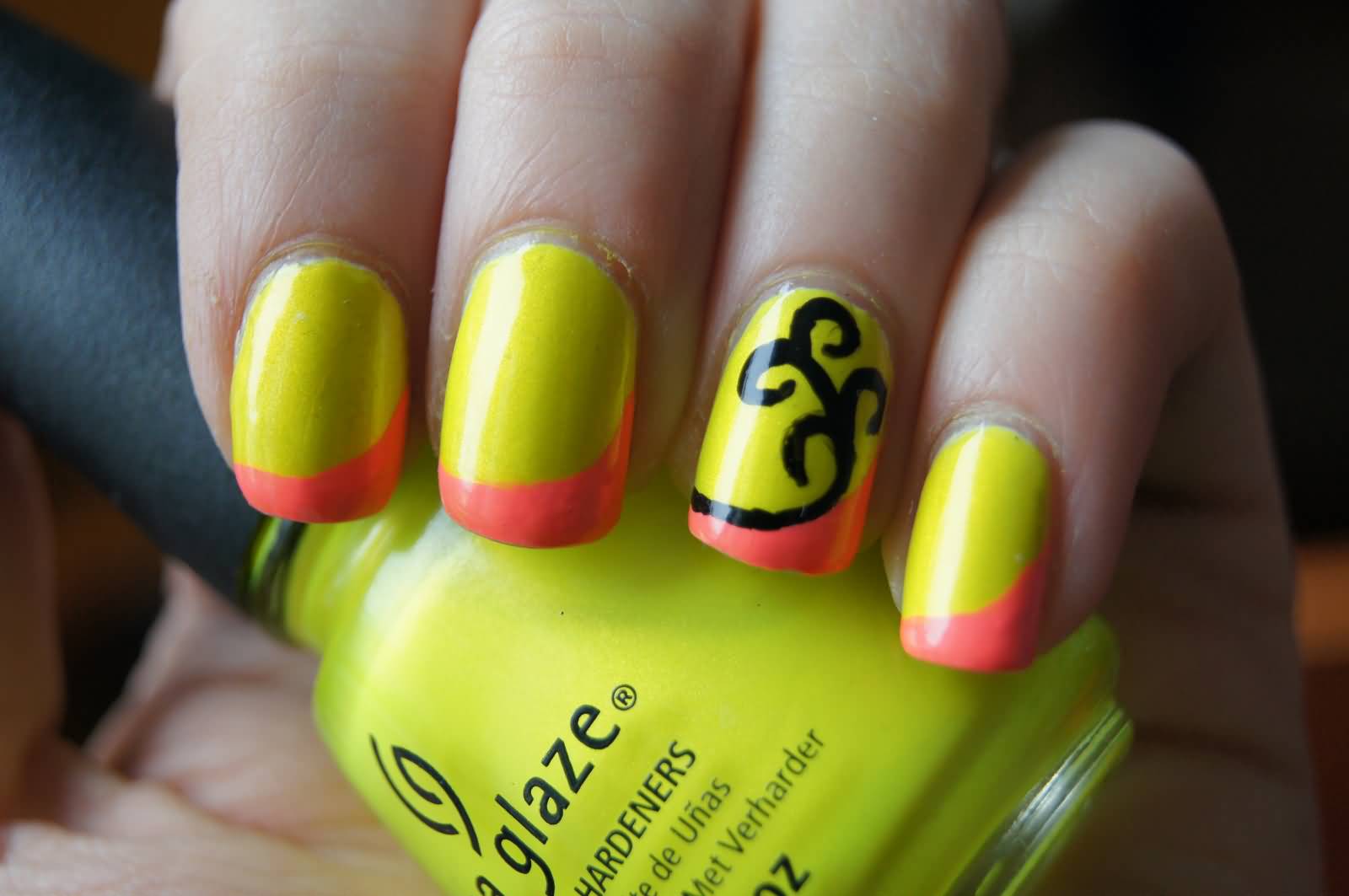 Neon Yellow And Orange Tip With Black Swirl Design Nail Art