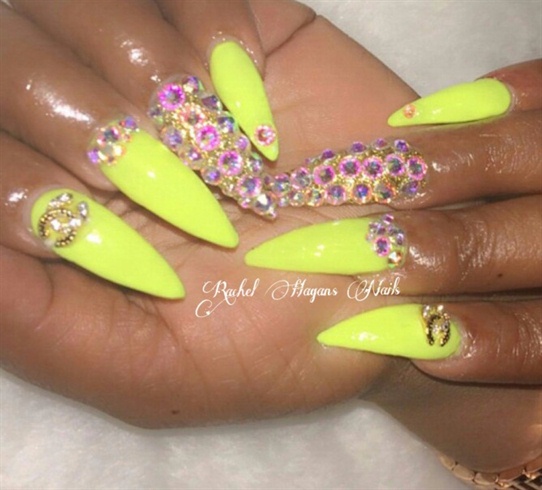 Neon Yellow Stiletto Nails With Crystals Design Idea