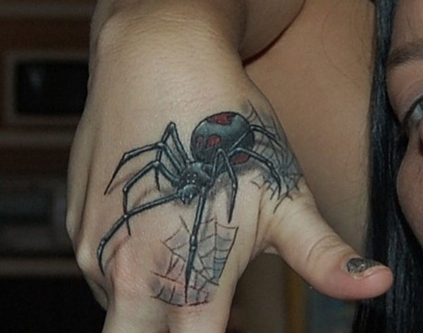 Nice Black Widow Tattoo On Hand For Girls