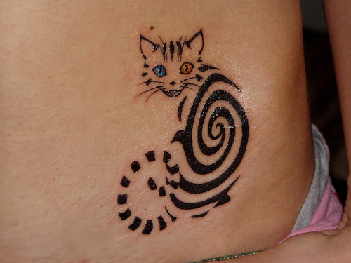 Nice Cat Spiral Tattoo On Hip